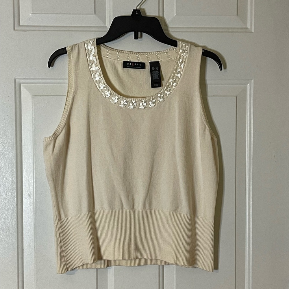 Axcess sleeveless round neck cream sweater.